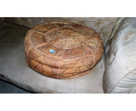 A leather pouffe