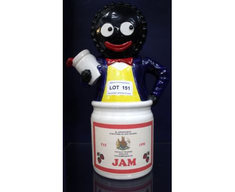 A "Totally Teapots" pottery "Good Golly" teapot, modelled emerging from the jam jar, with printed paper label, impressed and 