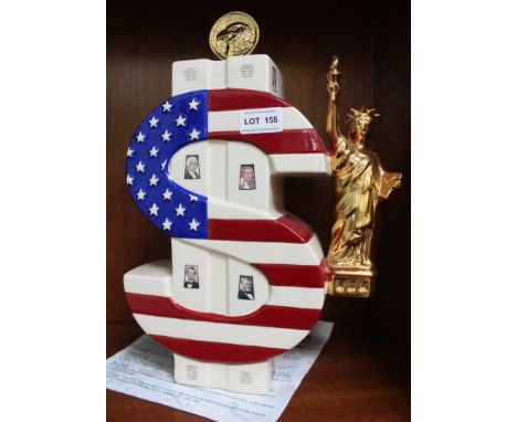 A "Totally Teapots" ceramic "In God We Trust" teapot in the form of a dollar sign, Limited edition number 22 of 50