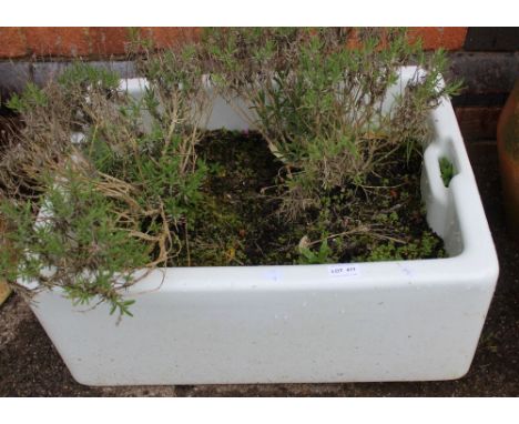 A white glazed Belfast sink garden planter