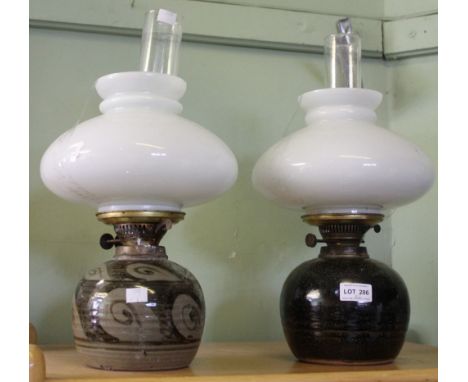 Two Winchcombe pottery lamp bases with glass funnel & shade The darker base does not have any stamp. The patterned one has th