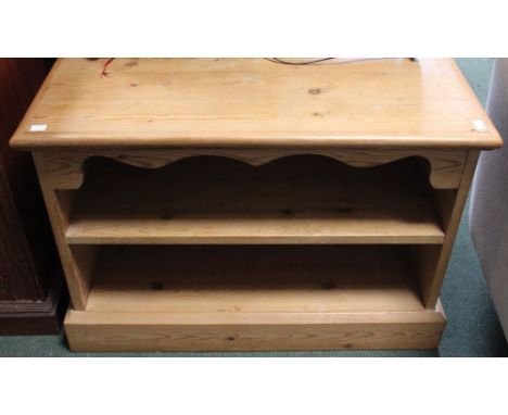 A low pine two shelf AV cabinet