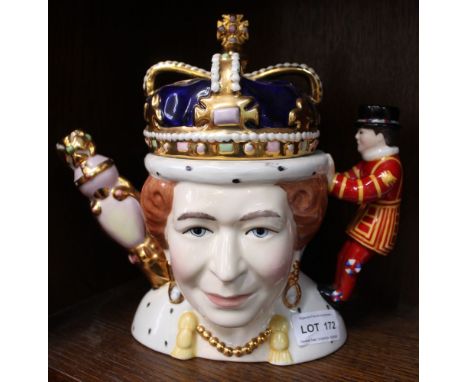 A "Totally Teapots" ceramic teapot, featuring Queen Victoria on one side and Queen Elizabeth ll on the other, limited edition