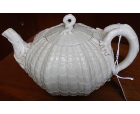 A "Belleek" ceramic teapot, sea urchin form with coral moulded handle and spout, black backstamp