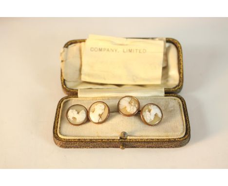 A boxed pair of early 20th century carved shell cameo copper and brass cuff links. Each one with a classical portrait. H.2 W.