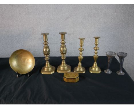 Two pairs of 19th century brass candlesticks, together with a pair of silver plated tapering vases, a brass dish and a brass 