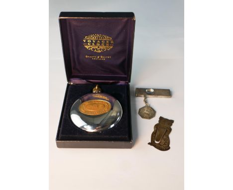 A boxed chrome plated Dalvey Voyager travel clock, the dial with Roman numerals, together with a engine white metal cigar cut
