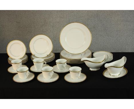 A Royal Tuscan 'Sovereign' part dinner set to include plates, cups and saucers and gravy boats. Dia.27cm. (largest). 