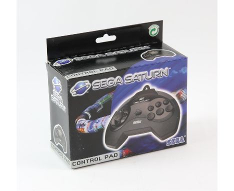 SEGA Saturn Control Pad - Model 1 - New - Boxed & Unused This lot contains an unused and boxed SEGA Saturn control pad. The p