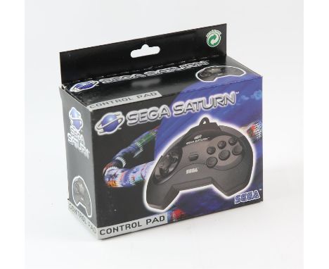 SEGA Saturn Control Pad - Model 1 - New - Boxed & Unused This lot contains an unused and boxed SEGA Saturn control pad. The p