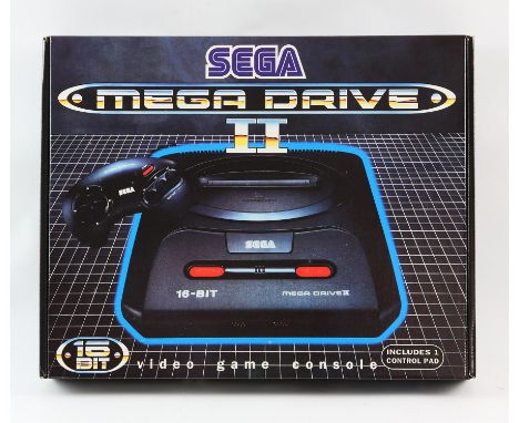 SEGA Mega Drive 2 - Boxed, New & Unused. This lot contains a boxed Mega Drive Model 2 - the console has never been used and e
