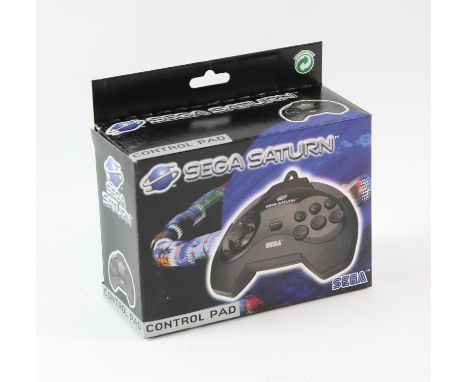 SEGA Saturn Control Pad - Model 1 - New - Boxed & Unused This lot contains an unused and boxed SEGA Saturn control pad. The p