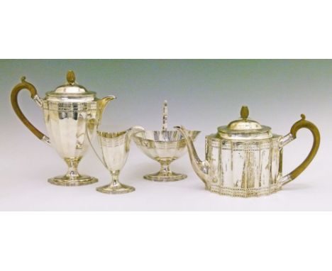 George V engraved silver four piece tea service, the teapot and hot water jug with wooden scroll handle and conforming carved