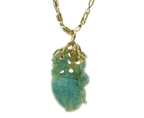 Carved jade pendant, in the form of a peach, to a branch like mount, tagged '18k', on a chain of fancy pierced links, 65cm lo