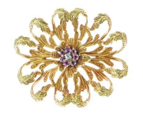 Ruby and diamond brooch, 1960's, the central cluster within a mount stamped '18k' of curled leaves, 3.8cm across, 9.4g gross 