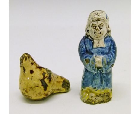 Two late 18th/early 19th Century English earthenware figural whistles, the first of Pratt type and formed as a clergyman wear