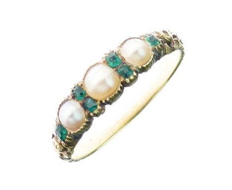 Victorian three stone pearl ring, with emerald points between and to the shoulders of the carved shank, size K¢, 2.2g gross, 