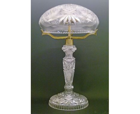 Heavily cut glass table lamp having a domed shade, 48.5cm high  Condition: Small chip to the lower edge of the shade approxim