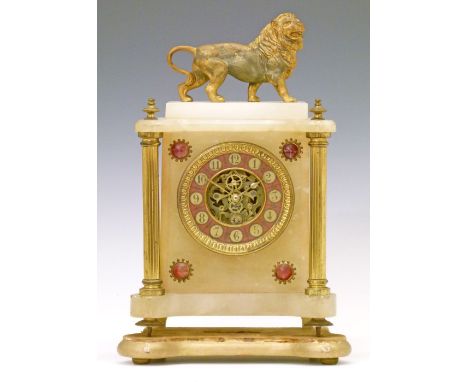 19th Century French alabaster cased mantel clock surmounted with a gilt spelter figure of a lion, the dial having a gilt and 