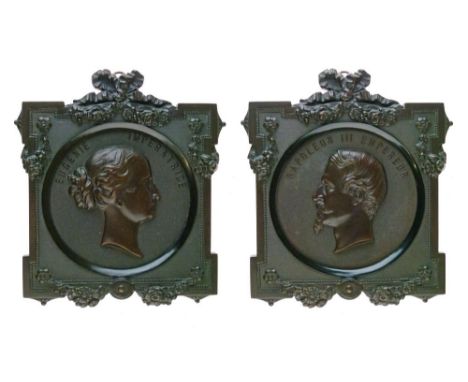 Pair of 19th Century Bois Durci portrait plaques - Emperor Napoleon III and Empress Eugenie, each within a foliate moulded Bo