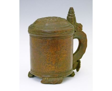 18th Century Norwegian birch peg tankard, the domed cover having carved decoration depicting a crowned lion, raised carved th