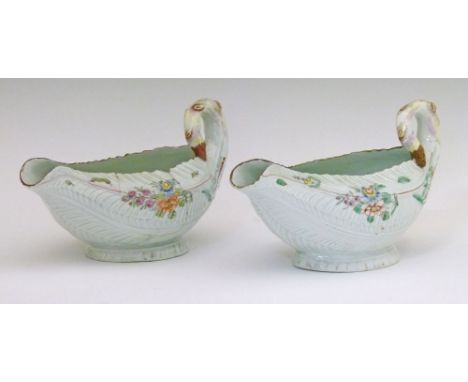 Pair of mid 18th Century Worcester leaf moulded sauce boats, each having polychrome foliate decoration and standing on an ova