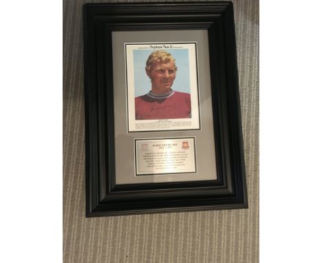Bobby Moore West Ham Signed Framed Display: Expensively framed with plaque below a large Typhoo Tea card which has been signe
