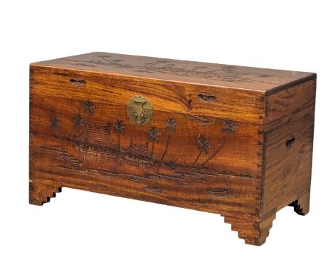 A large camphor wood trunk with carved decoration, circa 1930-50. 101cm x 50cm x 57.5cm 