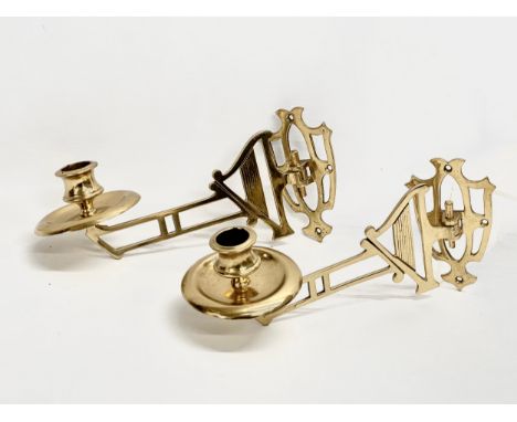 A pair of Early 20th Century brass harp design wall mounted candleholders. 22cm 
