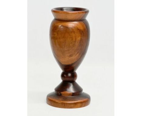 A 19th Century turned wooden Lignum Vitae vase. 18.5cm 