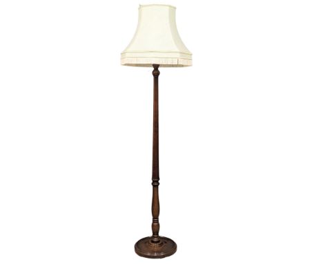 A mahogany standard lamp with reeded column. 197cm 