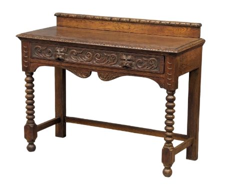 A late Victorian carved oak hall table with bobbin turn legs and Man Of The Forest handles, 107cm x 43cm x 84.5cm 