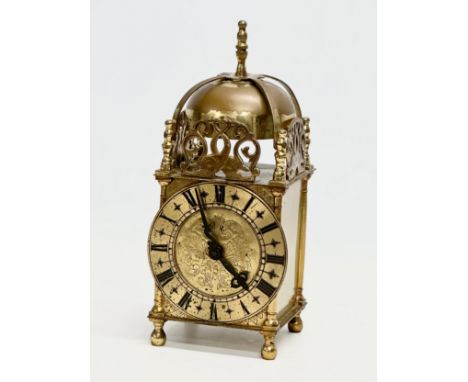 A vintage 18th century style brass mantle clock by Smiths. 10x10x25cm 
