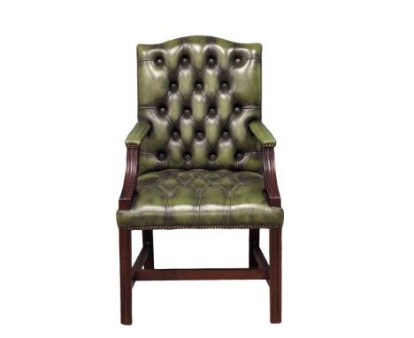 A George III style deep button leather Gainsborough armchair. 