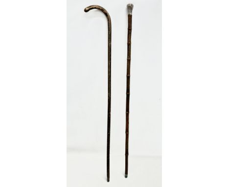 A silver mounted walking stick and other. 94cm 