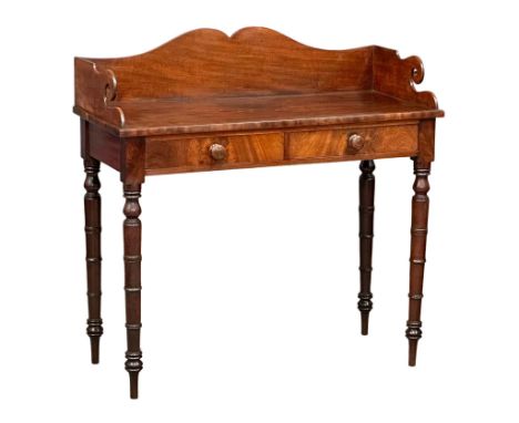 A late George IV mahogany gallery back side table on reeded legs, containing 2 front facing drawers. 99cm x 45cm x 100cm 3 