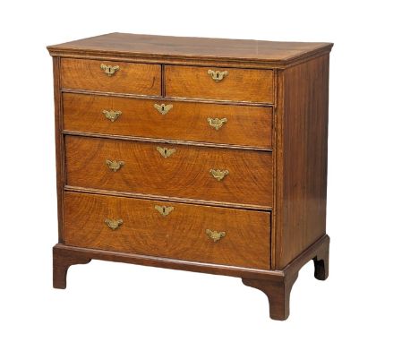 A George II oak chest of drawers with original handles and bracket feet, 94.5cm x 54.5cm x 94.5cm 