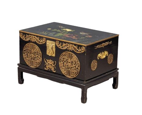 A Japanese lacquered brass bound trunk on stand with hand painted bird and flower motif. 73.5x48x49cm 