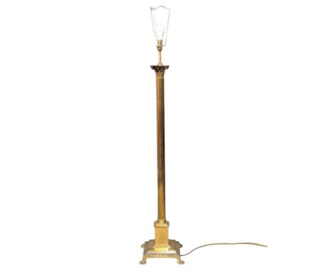 A brass Corinthian style standard lamp. 140cm 