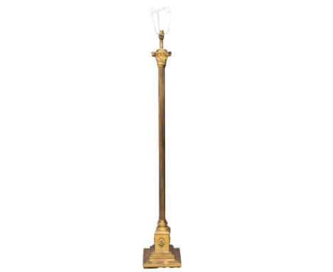 A vintage brass standard lamp with a reeded and Corinthian style column. 138cm 