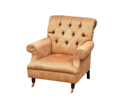 A Late Victorian style button back armchair on brass cup casters. 86x85x90cm 