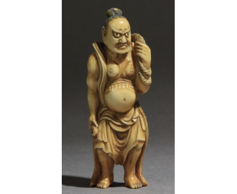 A mid 19th century Japanese netsuke from Edo period. Signed Tomochika on the back. In carved elephant tusk portraying a stand