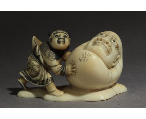 A mid 19th century Japanese netsuke. Signed Masahiro on the base. In carved elephant tusk and horn portraying a karako pushin