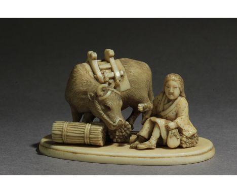 A Japanese netsuke-okimono from Edo period circa 1835-1860. Signed Norishige on the base. In carved elephant tusk portraying 