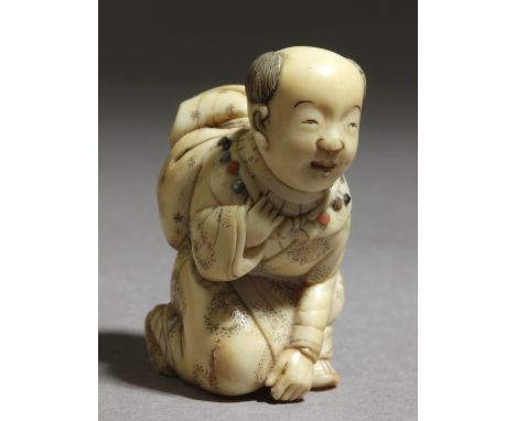 A Japanese netsuke from Meiji period circa 1840-1860. Signed Hidekazu on the base. In carved elephant tusk inlaid with mother