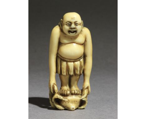 A 19th century Japanese netsuke from Edo period. Not signed. In carved elephant tusk portraying Tenaga standing over an octop