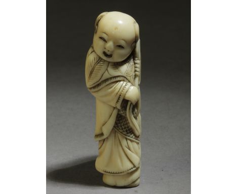 A late 18th century Japanese netsuke from Edo period. Not signed. In carved elephant tusk portraying a standing Karako grabbi