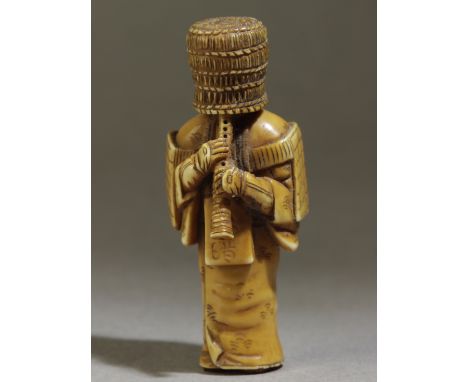 A 19th century Japanese netsuke. Signed Mitsuyuki on the back. In carved elephant tusk portraying 'Komuso' the warrior, who h