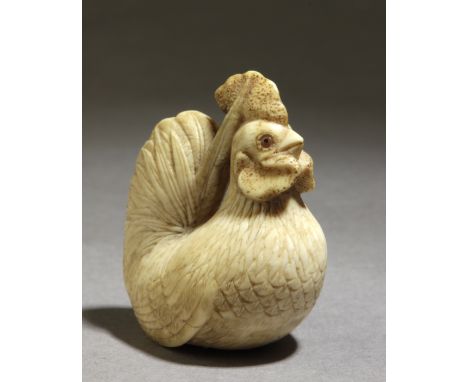 A 19th century Japanese netsuke. Signed Bunho on the base. In carved elephant tusk portraying a hen on the floor, touching he