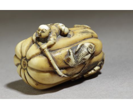 A mid 19th century Japanese netsuke from Edo period. Signed Masakazu on the base. In carved elephant tusk portraying a kappa 